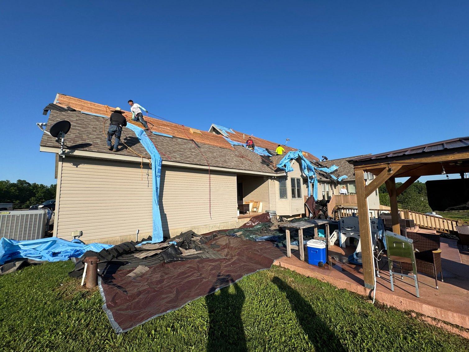 A completed roof replacement seen from the driveway