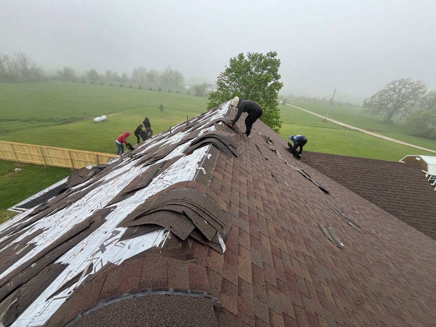 A new roof and gutter line on a brick home
